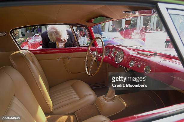 Judge views the interior of a 1956 Ferrari SpA 250 GT Boano sports vehicle during the 26th Annual Cavallino Classic Event at the Breakers Hotel in...