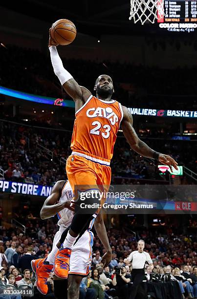 LeBron James of the Cleveland Cavaliers gets to the basket for a second half dunk in front of Jerami Grant of the Oklahoma City Thunder at Quicken...