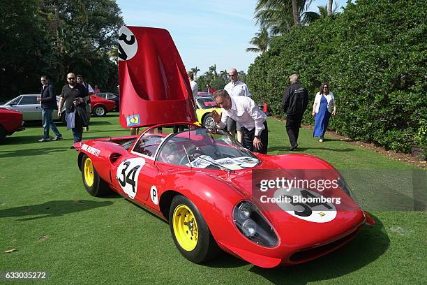 Childern sit inside a 1963 Ferrari Dino 206 S race vehicle during the 26th Annual Cavallino Classic Event at the Breakers Hotel in Palm Beach,...