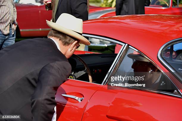 Judge views the interior of a 1963 Ferrari SpA 330 LMB race vehicle during the 26th Annual Cavallino Classic Event at the Breakers Hotel in Palm...