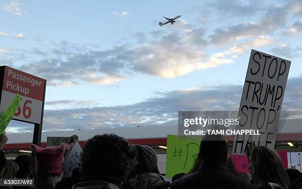 Protestors crowd the sidewalks at HartsfieldJackson Atlanta International Airport to denounce US President Donald Trump's executive order, which...