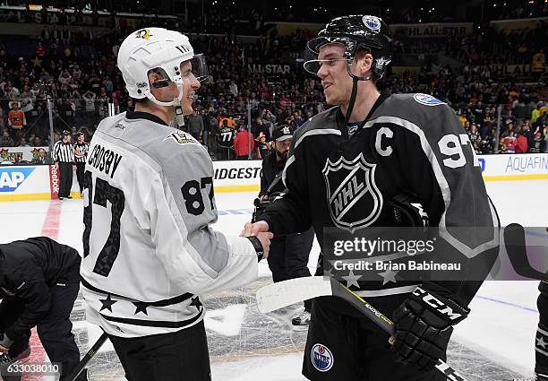 Sidney Crosby of the Pittsburgh Penguins and Connor McDavid of the Edmonton Oilers shake hands after their Metropolitan Division and Pacific Division...