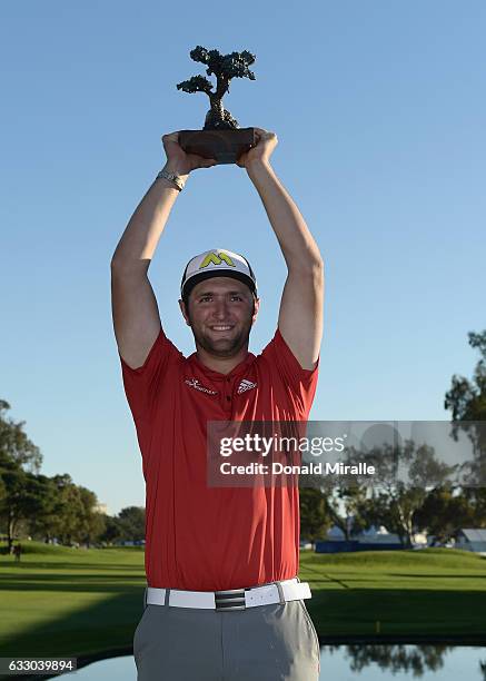 Jon Rahm of Spain poses with the trophy during the final round of the Farmers Insurance Open at Torrey Pines South on January 29, 2017 in San Diego,...