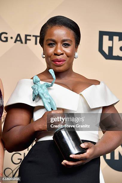 Actor Uzo Aduba, winner of the Outstanding Ensemble in a Comedy Series award of 'Orange Is the New Black,' pose in the press room during the 23rd...