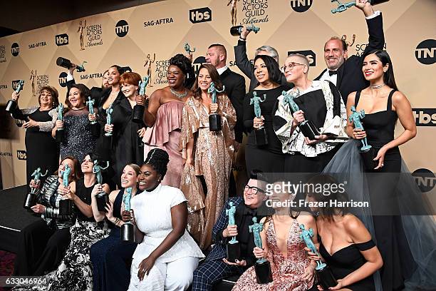 Orange Is the New Black cast members, winners of the Outstanding Performance by an Ensemble in a Comedy Series award, pose in the press room during...
