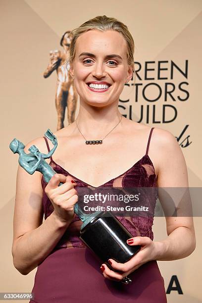 Actor Taylor Schilling, winner of the Outstanding Ensemble in a Comedy Series award of 'Orange Is the New Black,' pose in the press room during the...