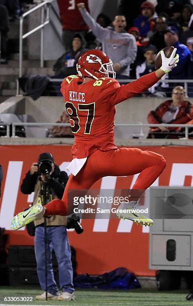 Travis Kelce of the AFC completes a pass for a touchdown in the second quarter against the NFC during the NFL Pro Bowl at the Orlando Citrus Bowl on...