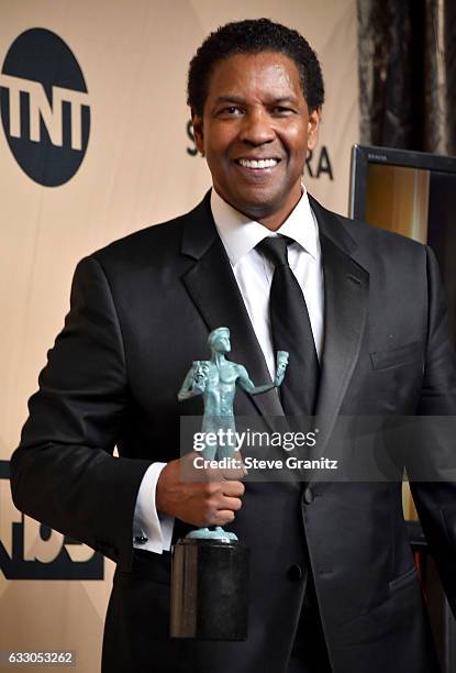 Actor/director Denzel Washington, winner of the Outstanding Male Actor in a Leading Role award for 'Fences,' poses in the press room during the 23rd...