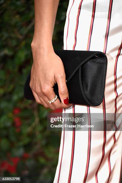 Actor Naomie Harris, ring, manicure, purse, and fashion details, attends The 23rd Annual Screen Actors Guild Awards at The Shrine Auditorium on...