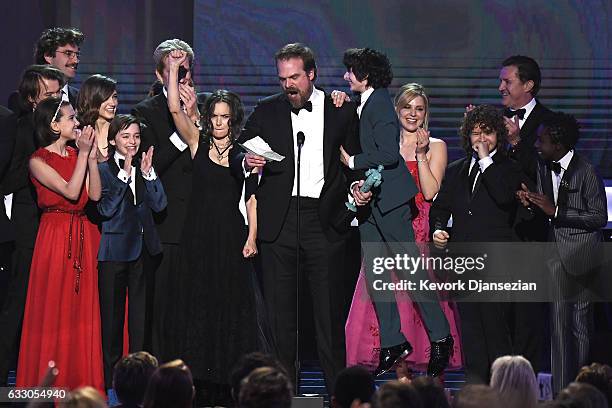 The cast of Stranger Things accepts the award for Best Ensemble in a Drama Series onstage during the 23rd Annual Screen Actors Guild Awards at The...