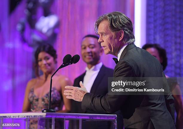 Actor William H. Macy accepts Outstanding Performance by a Male Actor in a Comedy Series for 'Shameless' from recording artist John Legend and actor...