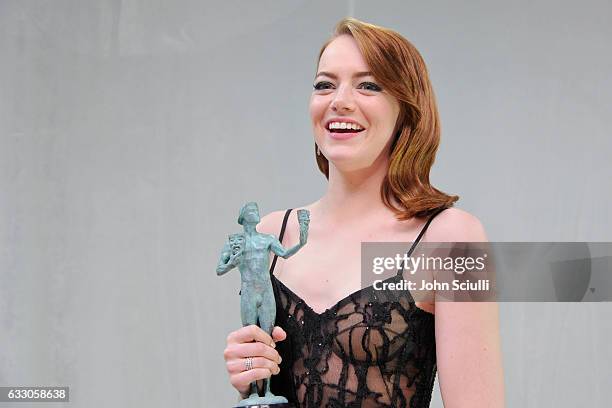 Actor Emma Stone, winner of the Outstanding Performance by a Female Actor in a Leading Role award for 'La La Land,' poses in the press room during...