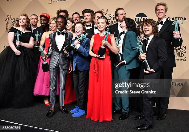 The cast of 'Stranger Things' pose with the award for Outstanding Ensemble in a Drama Series in the press room during the 23rd Annual Screen Actors...