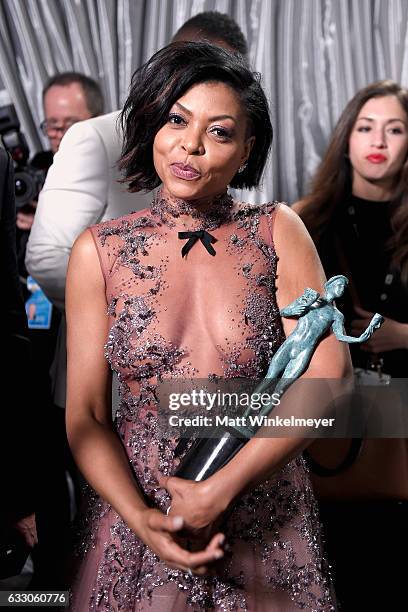 Actor Taraji P. Henson, co-recipient of the Outstanding Performance by a Cast in a Motion Picture award for 'Hidden Figures,' poses in the press room...