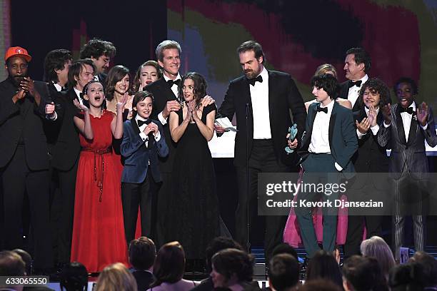 The cast of Stranger Things accepts the award for Best Ensemble in a Drama Series onstage during the 23rd Annual Screen Actors Guild Awards at The...