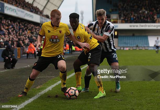 Watford's Ben Watson, Millwall's Steve Morison holds of Watford's Brandon Mason during The Emirates FA Cup - Fourth Round match between Millwall...