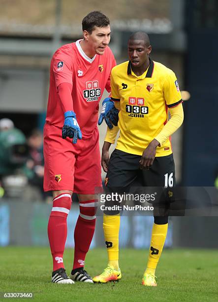 Watford's Costel Pantilimon and Watford's Abdoulaye Doucoure during The Emirates FA Cup - Fourth Round match between Millwall against Watford at The...