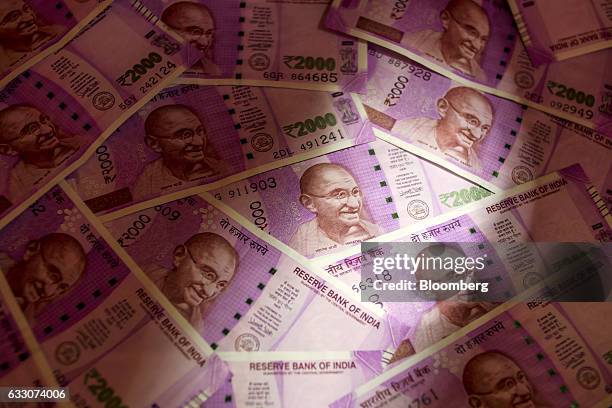 Indian two thousand rupee banknotes are arranged for a photograph in Mumbai, India, on Sunday, Jan. 29, 2016. Reviving India's growth and boosting...