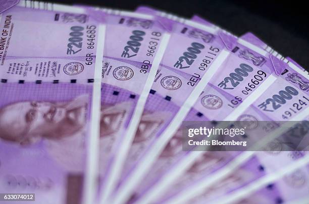 Indian two thousand rupee banknotes are arranged for a photograph in Mumbai, India, on Sunday, Jan. 29, 2016. Reviving India's growth and boosting...