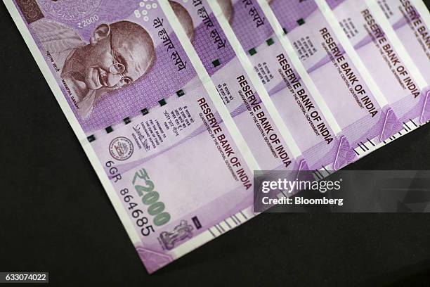 Indian two thousand rupee banknotes are arranged for a photograph in Mumbai, India, on Sunday, Jan. 29, 2016. Reviving India's growth and boosting...