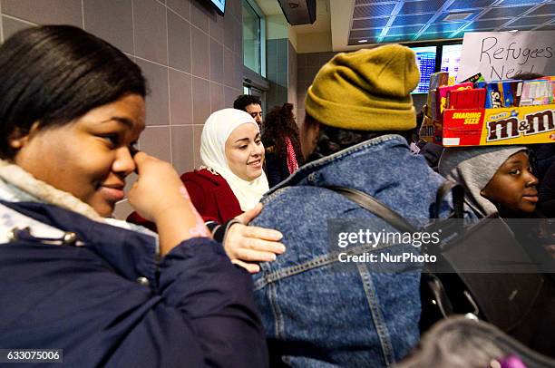 Magd Martini is hugged protestors as thousands came out in support and to protest the Muslim Ban at a large scale protest at Philadelphia...