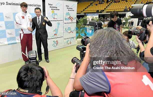 Ippei Watanabe and Kosuke Kitajima pose for photographs at the award ceremony during day two of the Kosuke Kitajima Cup Tokyo Swimming Championships...