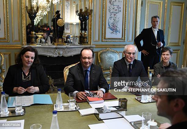 French President Francois Hollande , next to French Housing Minister Emmanuelle Cosse and French Junior Minister for European Affairs Thierry...