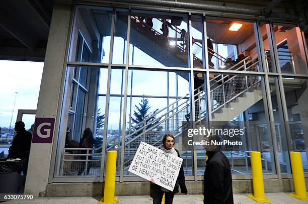 Small group attempt to find an entry point into the Airport at a January 29th, 2017 Immigration Ban Protest at Philadelphia International Airport, in...