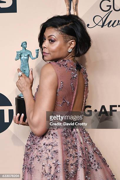 Actress Taraji P. Henson co-recipient of the Outstanding Performance by a Cast in a Motion Picture award for 'Hidden Figures,' poses in the press...