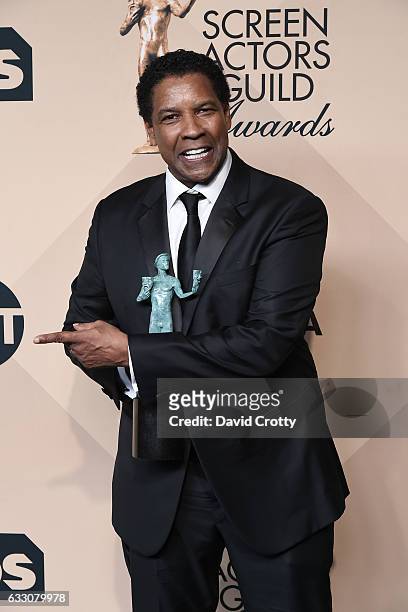 Actor Denzel Washington, winner of the Outstanding Performance by a Male Actor in a Leading Role award for 'Fences,' poses in the press room at the...
