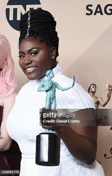 Actress Danielle Brooks, co-recipient of the Outstanding Performance by an Ensemble in a Comedy Series award for 'Orange is the New Black,' poses in...