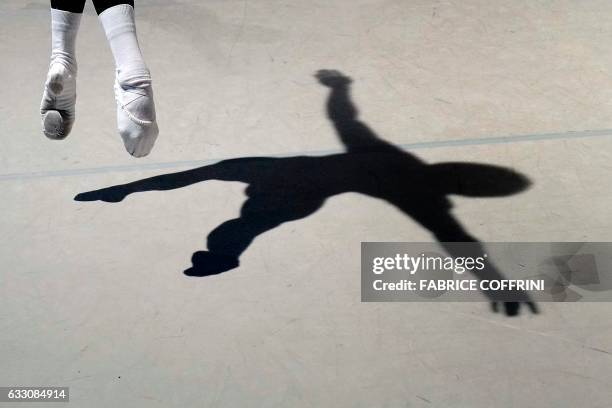 The shadow of a young dancer is cast on the stage during the contemporary class of the 45th International Ballet Competition "Prix de Lausanne" on...