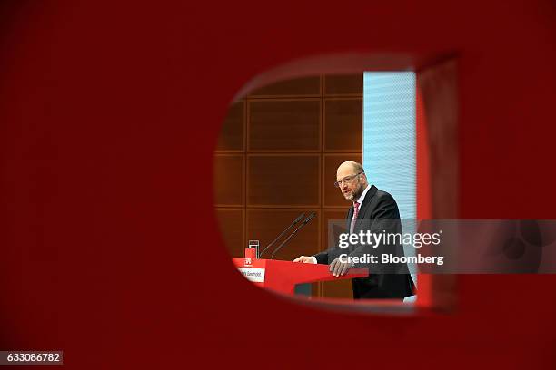 Martin Schulz, the Social Democrat Party candidate for German Chancellor, is seen through the SPD logo while speaking during a news conference at the...