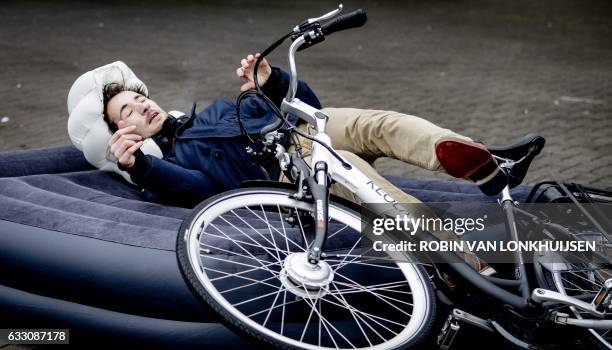 An employee demonstrates the bicycle airbag manufactured by Keola in cooperation with the Dutch drivers association ANWB in Amersfoort, The...