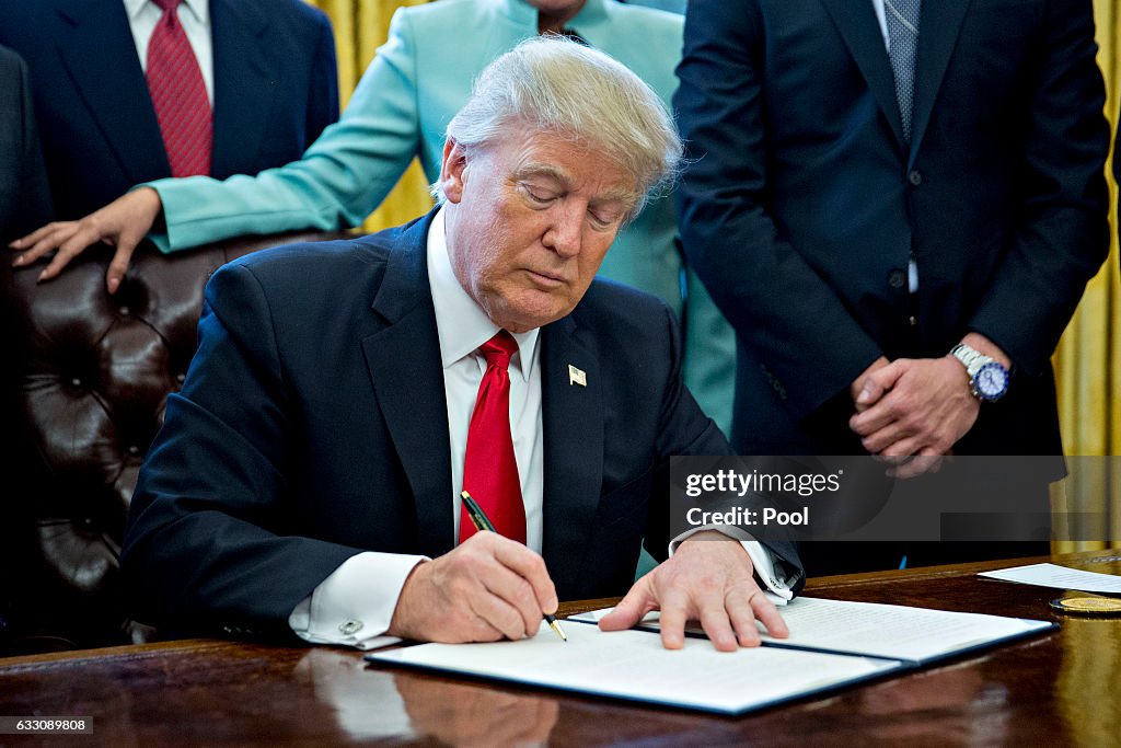 President Trump Signs Executive Order In Oval Office Of The White House