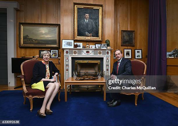 British Prime Minister Theresa May sits beside Irish Taoiseach Enda Kenny in his office at Government Buildings on January 30, 2017 in Dublin,...