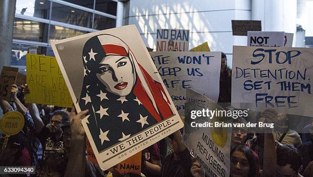 Protesters of Donald Trump's new immigration order crowd the Tom Bradley International Terminal at LAX on January 29, 2017 in Los Angeles, California.