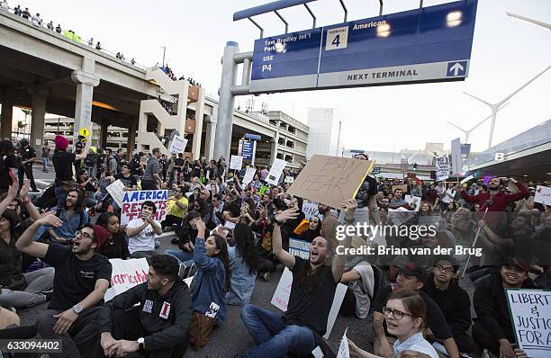 Hundreds gather blocking traffic on the arrival level of the Tom Bradley International Terminal to protest Donald Trump's new immigration order at...