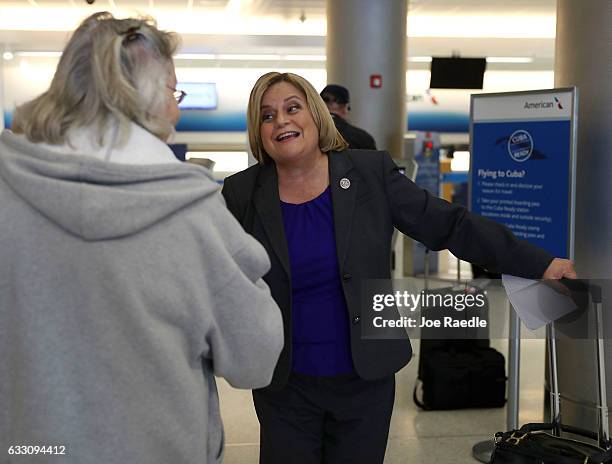 Rep. Ileana Ros-Lehtinen greets a person after speaking to the media about President Donald Trump's new executive order barring US entry for natives...