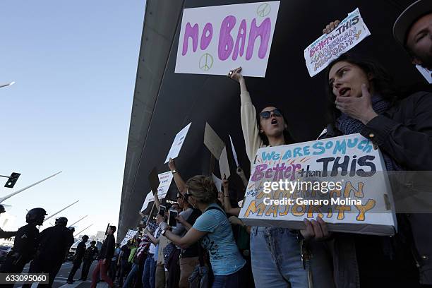 People continue to protest President Donald Trump's travel ban at the Tom Bradley International Terminal at LAX on January 29, 2017 in Los Angeles,...