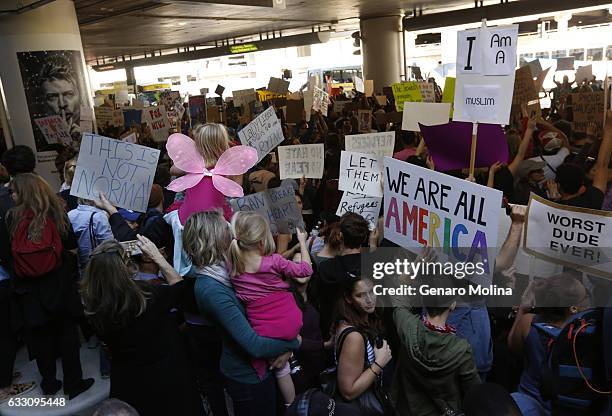 Hundreds of people continue to protest President Donald Trump's travel ban at the Tom Bradley International Terminal at LAX on January 29, 2017 in...