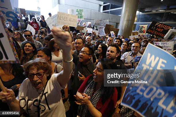 Hundreds of people continue to protest President Donald Trump's travel ban at the Tom Bradley International Terminal at LAX on January 29, 2017 in...