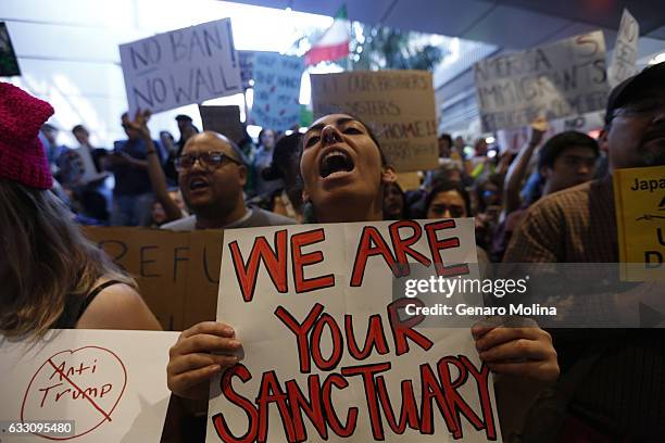 People continue to protest President Donald Trump's travel ban at the Tom Bradley International Terminal at LAX on January 29, 2017 in Los Angeles,...