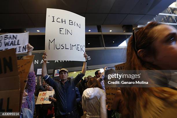 People continue to protest President Donald Trump's travel ban at the Tom Bradley International Terminal at LAX on January 29, 2017 in Los Angeles,...