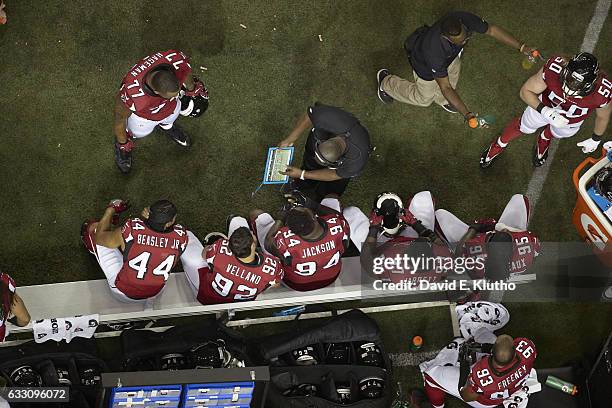 Playoffs: Overhead view of Atlanta Falcons coach reviewing play with defense line on the sidelines vs Green Bay Packers at Georgia Dome. Atlanta, GA...