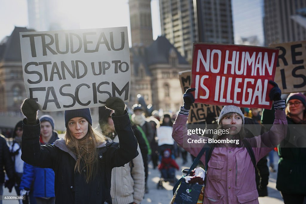 Demonstrators Protest President Trump's Travel Ban Outside Of The U.S. Consulate