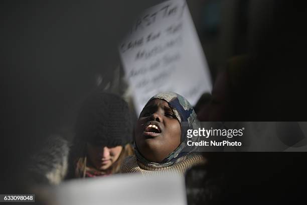 Muslim women of African origin chanting slogans in front of the US Consulate in Toronto to speak up against the Executive Orders of US President...