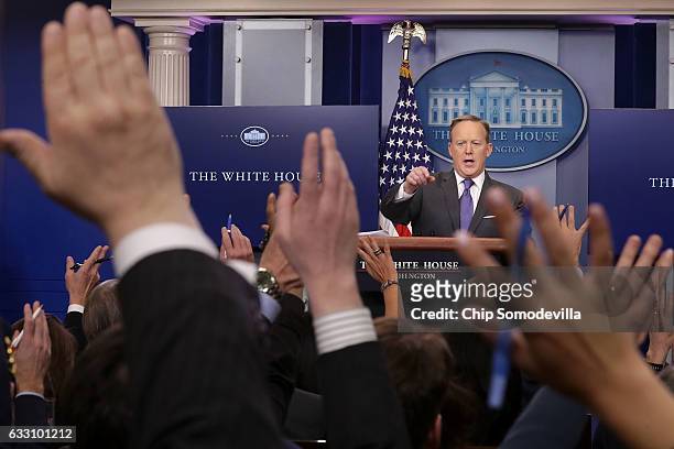White House Press Secretary Sean Spicer reacts to reporters' questions in the Brady Press Briefing Room at the White House January 30, 2017 in...