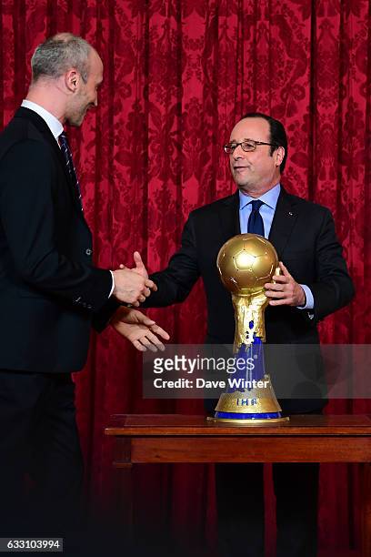 French president Francois Hollande, seen here with captain Thierry Omeyer, hosts a reception for the France handball team at the Elysee Palace on...