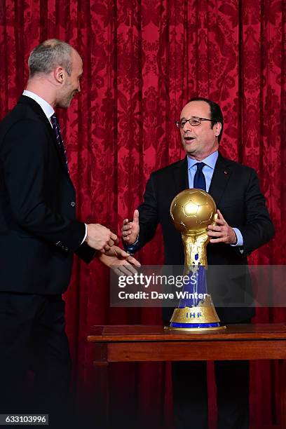 French president Francois Hollande, seen here with captain Thierry Omeyer, hosts a reception for the France handball team at the Elysee Palace on...